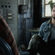 Tommy sitting and talking to his brother Joel as seen in a cutscene from The Last of Us on PS3.